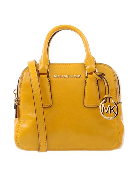 michael kors yellow and white purse|yellow michael kors backpack.